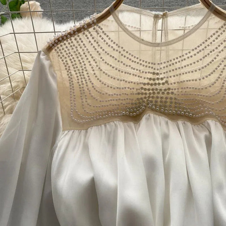Levoire | Haut de vêtement à la conception élégante en tulle transparent et avec des volants ornés de perles