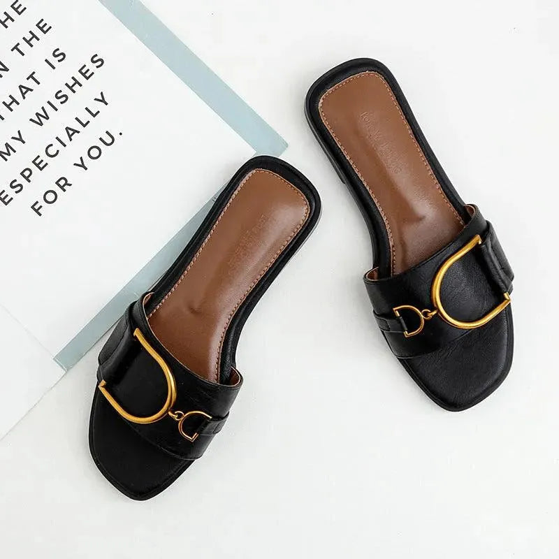 Levoire | Sandales plates élégantes avec boucle dorée Noir