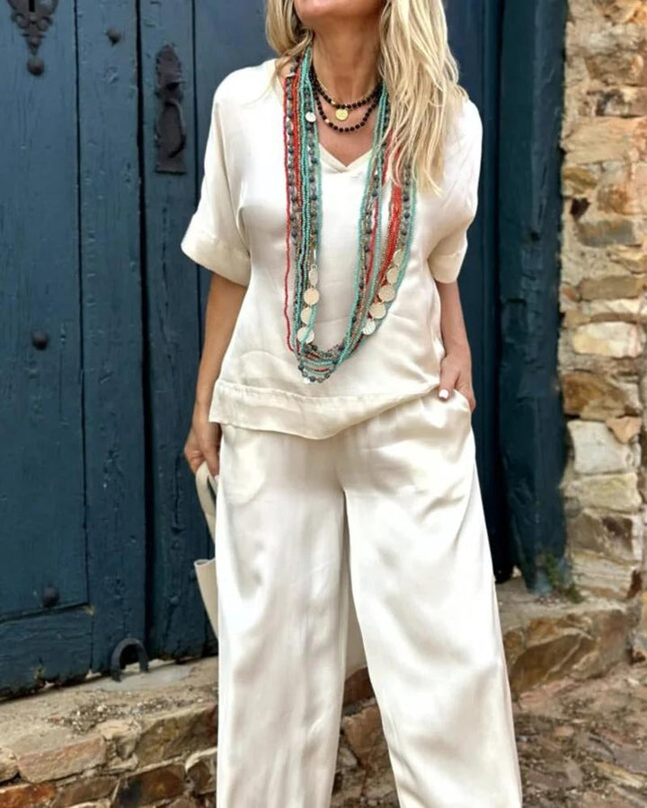Levoire | Ensemble Élégant Composé D'Une Chemise À Col En V Blanc Et De Pantalons Évasés