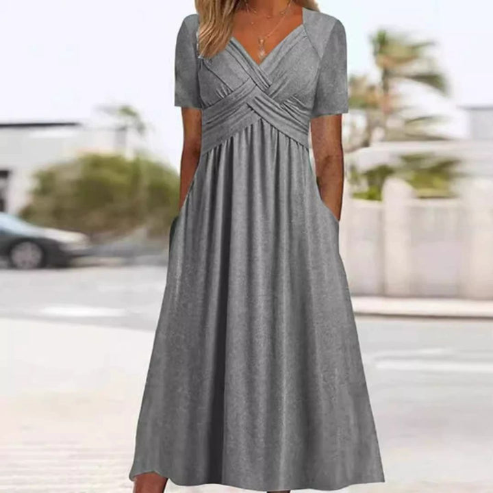 Levoire | Robe Élégante À Décolleté En V Avec Taille Empire Et Poches Pour Dames Gris