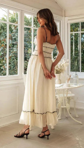 Levoire | Robe longue avec des bretelles estivales et motif à pois avec un ruban