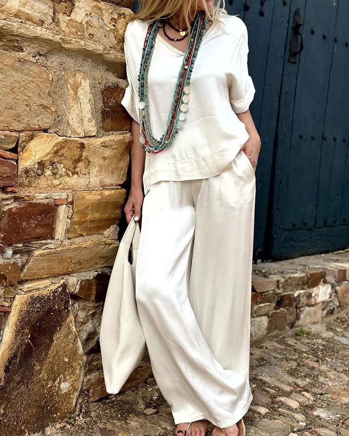 Levoire | Ensemble Élégant Composé D'Une Chemise À Col En V Blanc Et De Pantalons Évasés