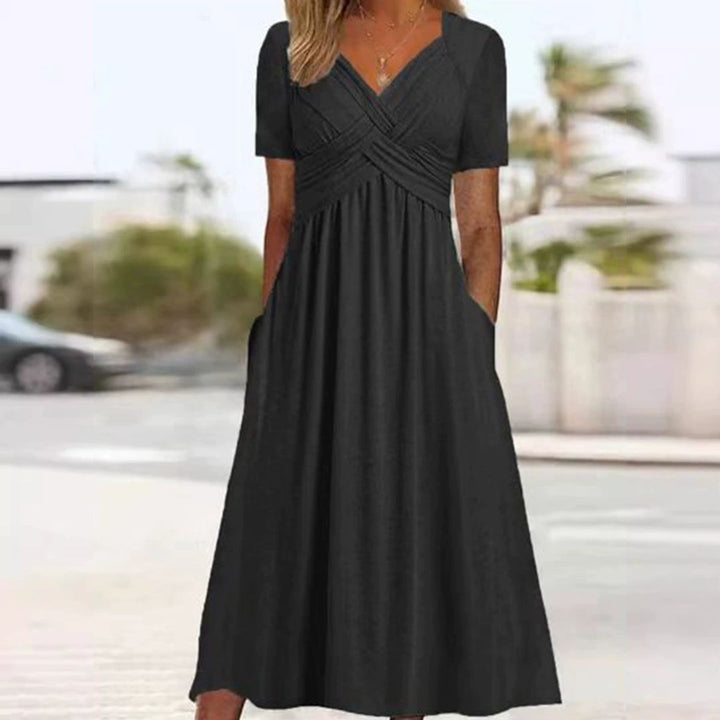 Levoire | Robe Élégante À Décolleté En V Avec Taille Empire Et Poches Pour Dames Noir