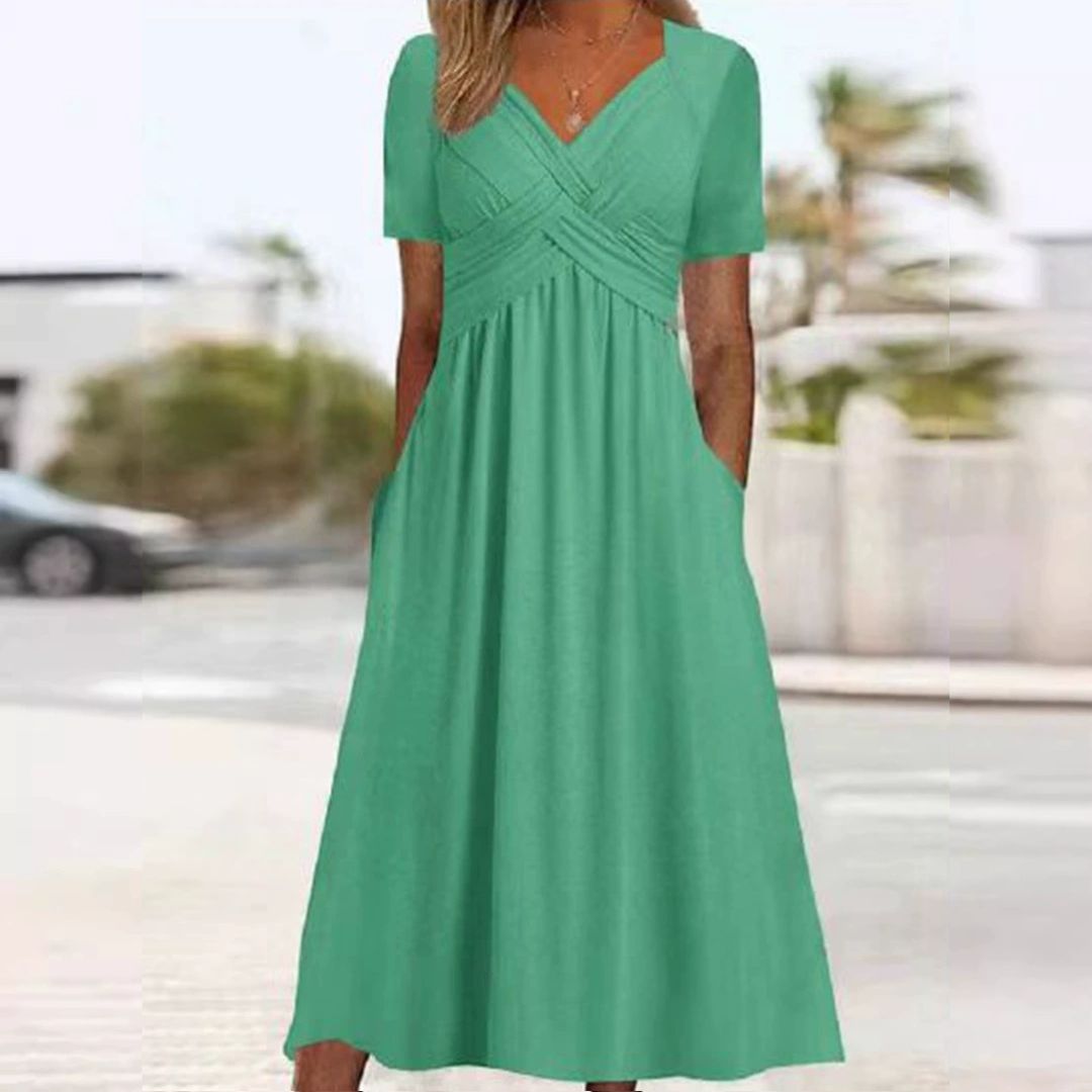 Levoire | Robe Élégante À Décolleté En V Avec Taille Empire Et Poches Pour Dames Vert