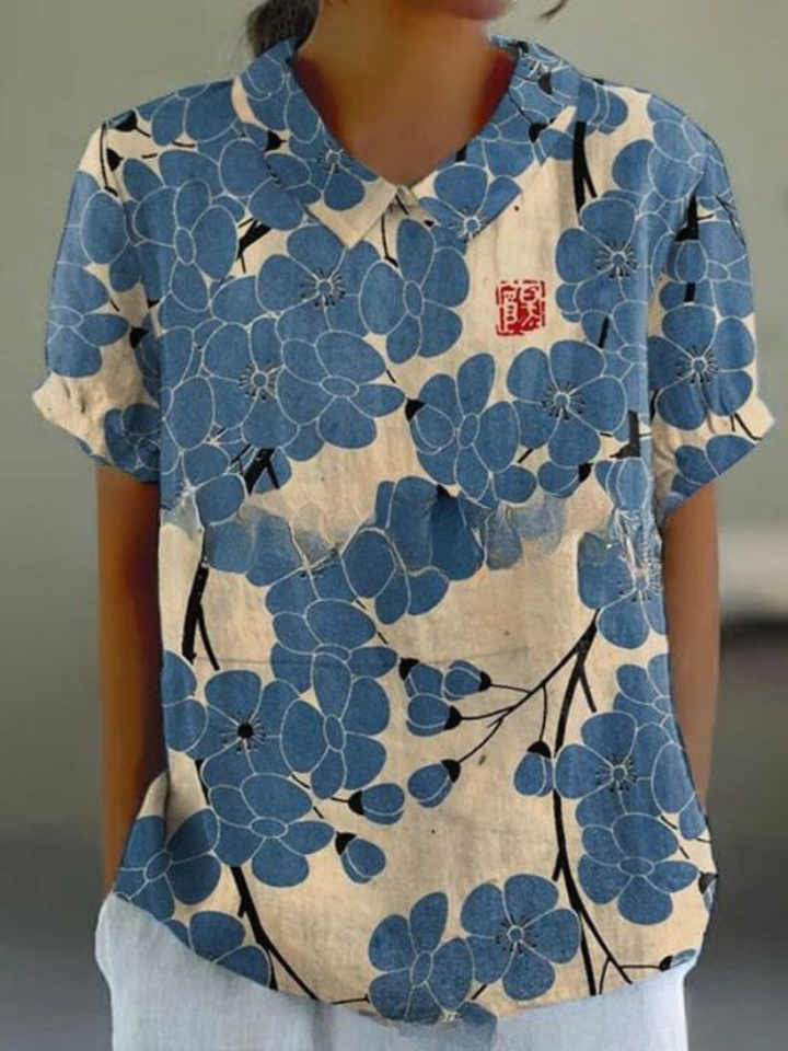 Levoire | Blouse Féminine Élégante Avec Motif Floral Blanc avec des fleurs bleues