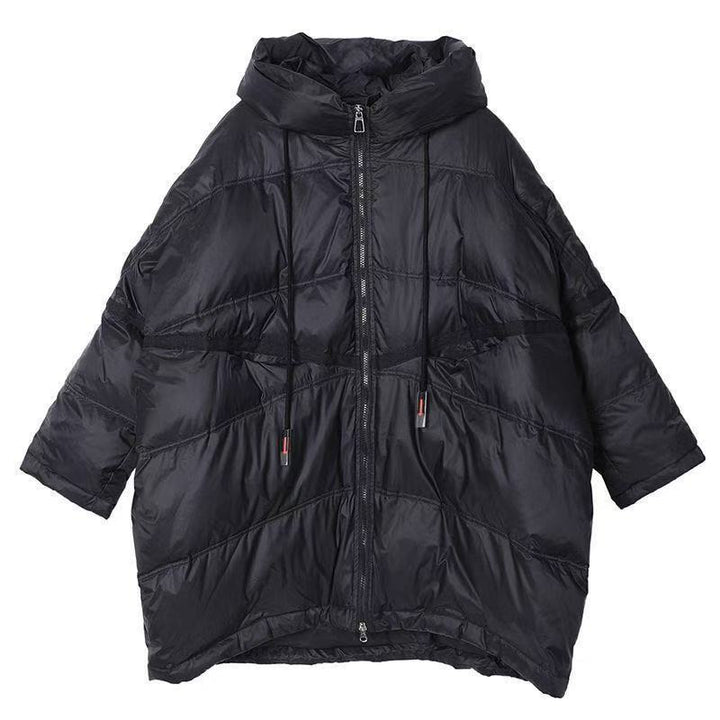 Veste de transition matelassée pour femmes avec capuche généreuse et détails modernes Levoire