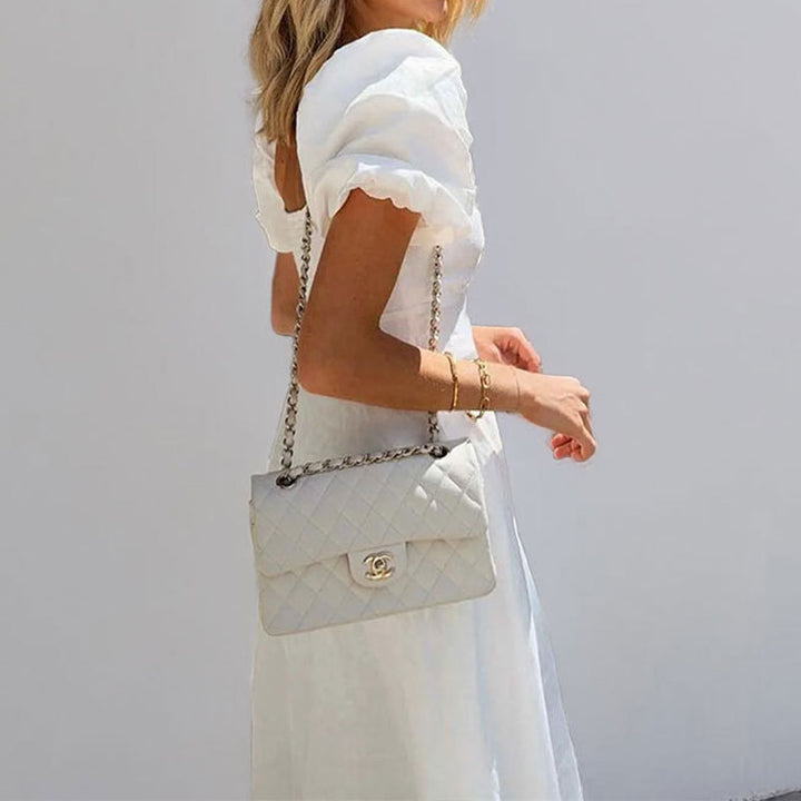 Robe maxi pour femmes avec un design clé sophistiqué et des manches puff volumineuses Levoire
