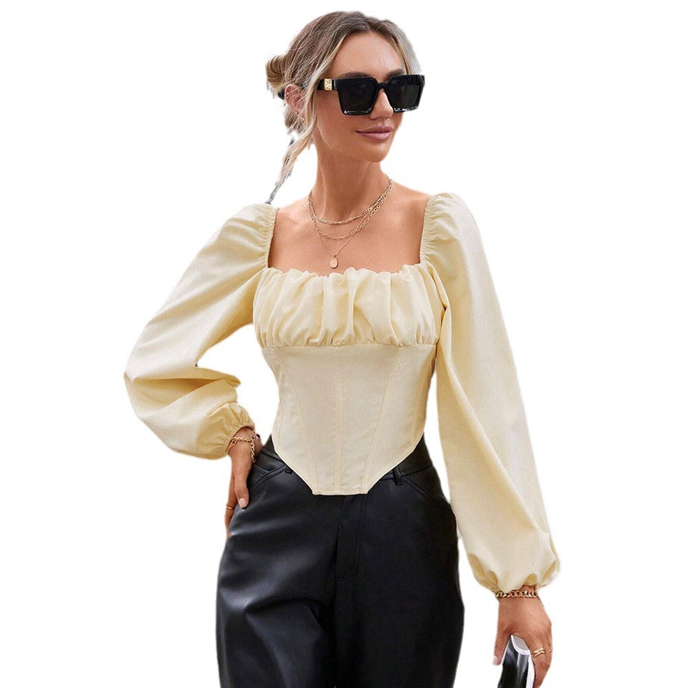 Blouse en dentelle pour femmes avec manches bouffantes et silhouette cintrée Levoire
