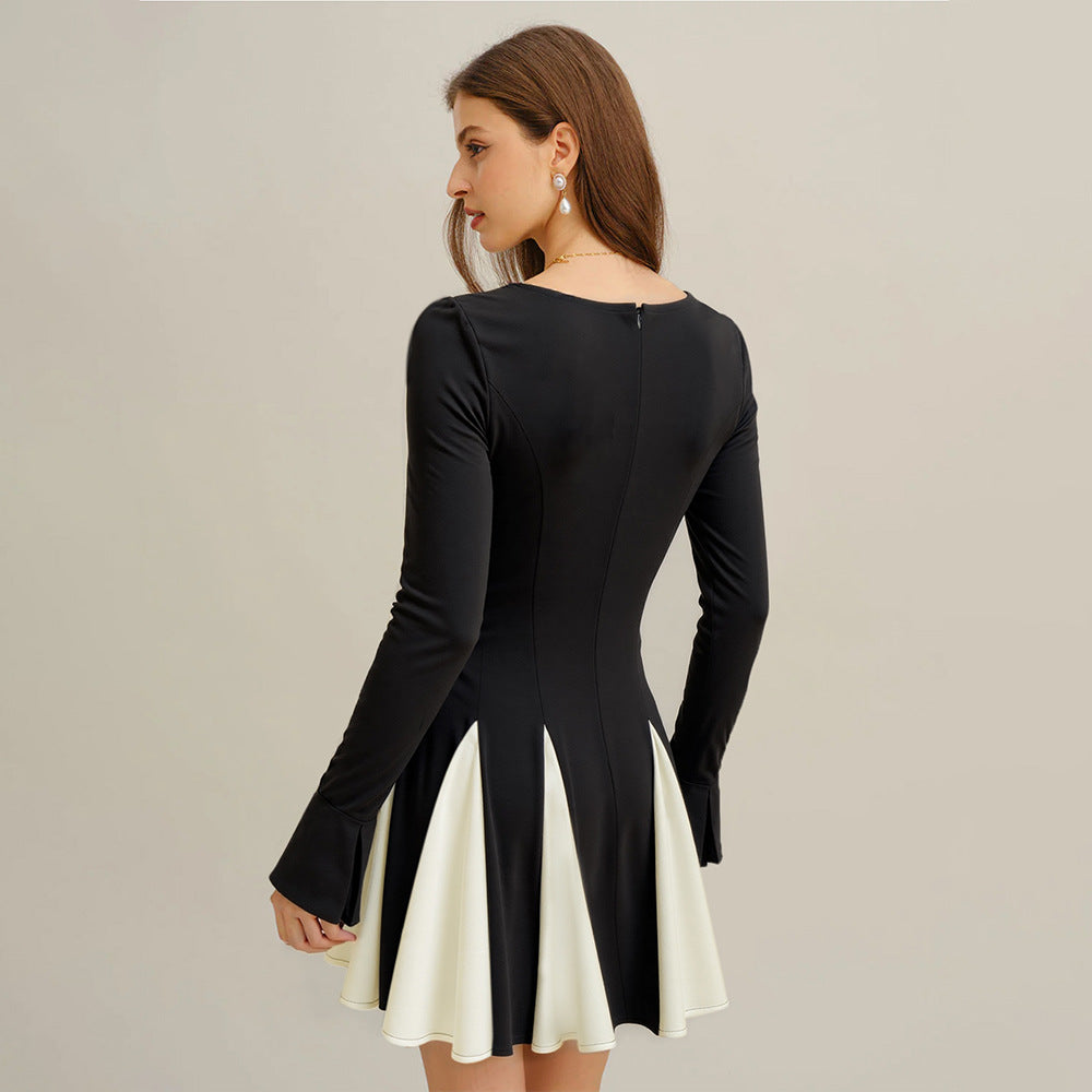 Robe femme en A avec de élégantes manches bouffantes et un contraste de couleurs tendance Levoire