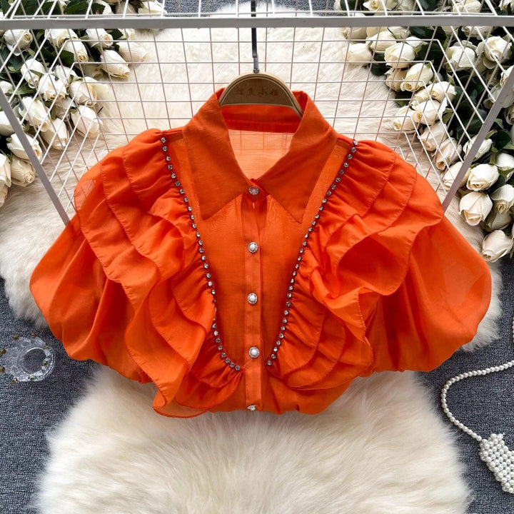 Levoire | Top avec des diamants transparents et fins et des manches bouffantes Orange Rouge Taille libre