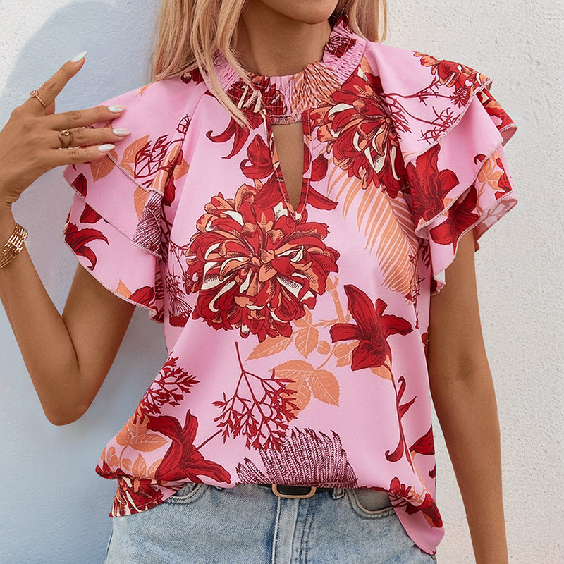 Top féminin avec des détails de volants ludiques et un motif floral Levoire
