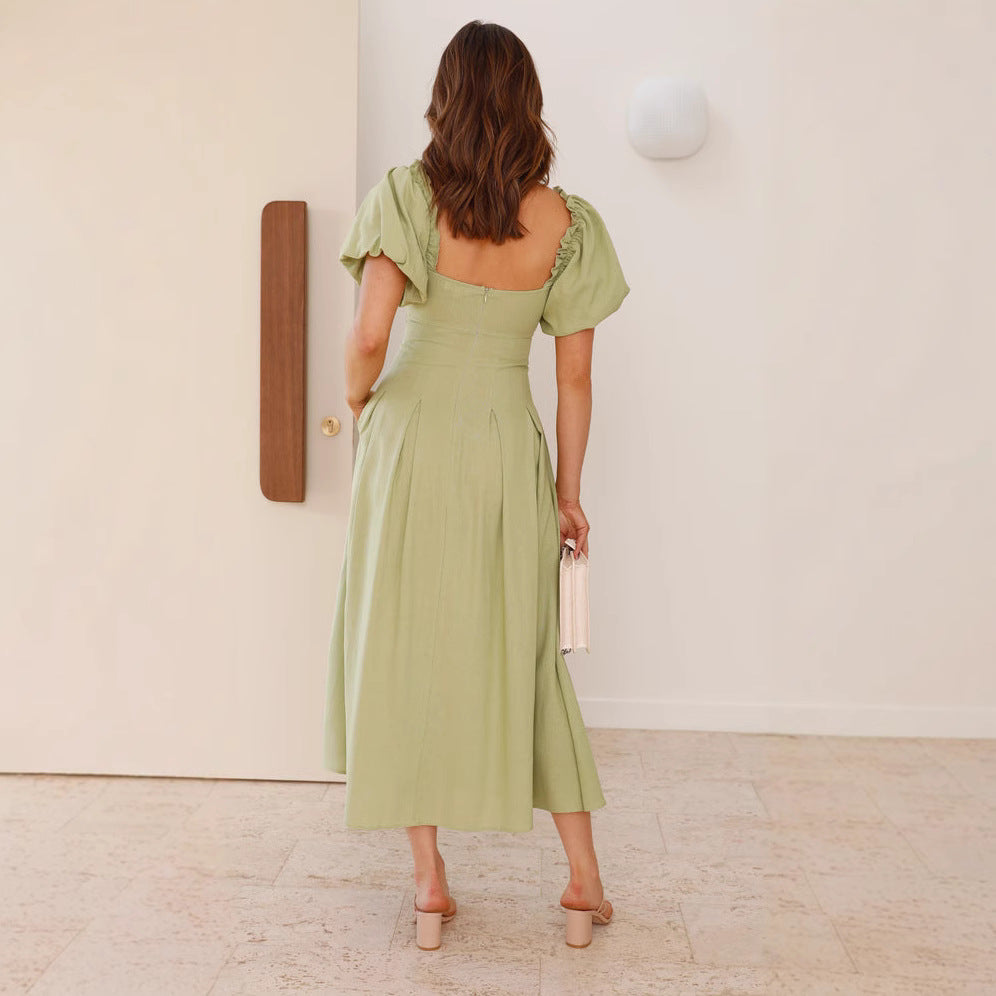 Robe midi femme avec un détail de nœud ludique et un design à manches bouffantes Levoire