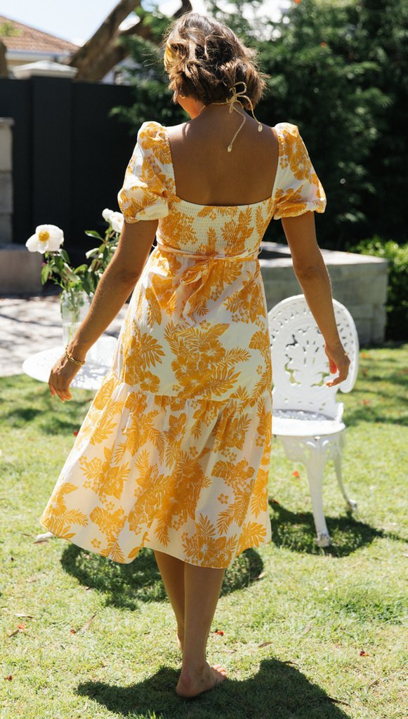 Robe midi femme avec décolleté en cascade et détails floraux Levoire