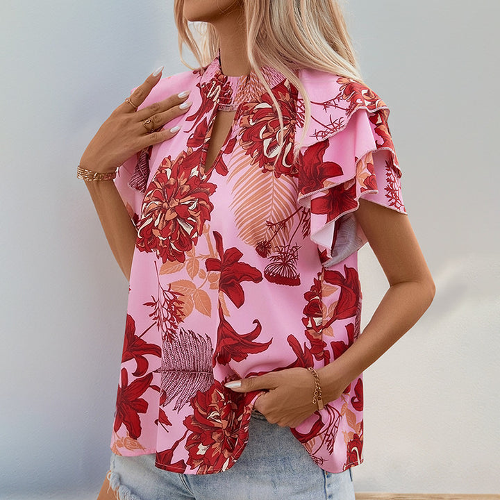 Top féminin avec des détails de volants ludiques et un motif floral Levoire