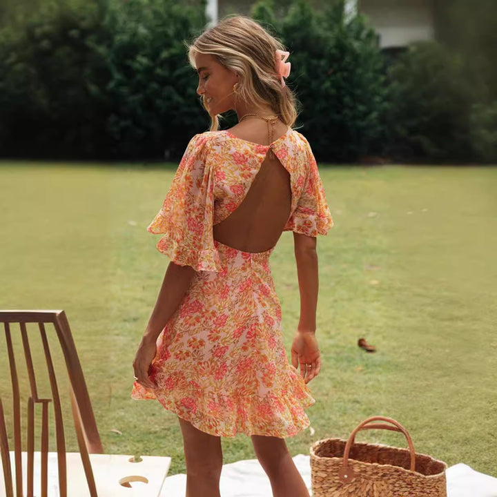 Robe portefeuille mini pour femme avec des manches volumineuses et découpe romantique au dos Levoire