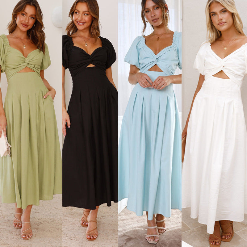 Robe midi femme avec un détail de nœud ludique et un design à manches bouffantes Levoire