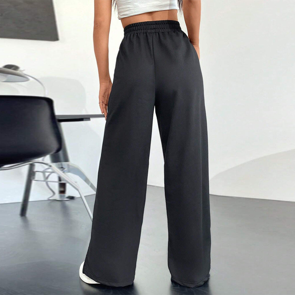 Pantalons satinés larges pour femmes avec taille élastique et fentes latérales Levoire