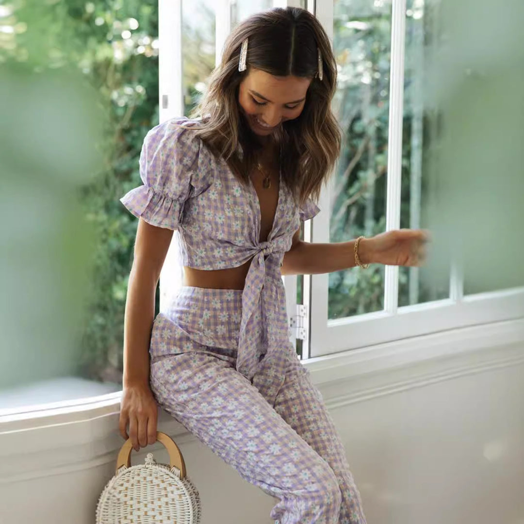 Ensemble femme en deux pièces avec un haut orné de nœuds et un pantalon à coupe large Levoire