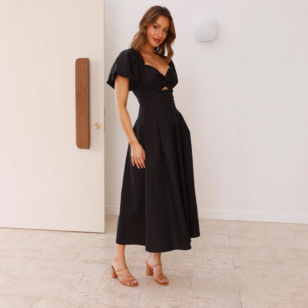 Robe midi femme avec un détail de nœud ludique et un design à manches bouffantes Levoire