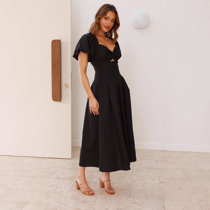 Robe midi femme avec un détail de nœud ludique et un design à manches bouffantes Levoire