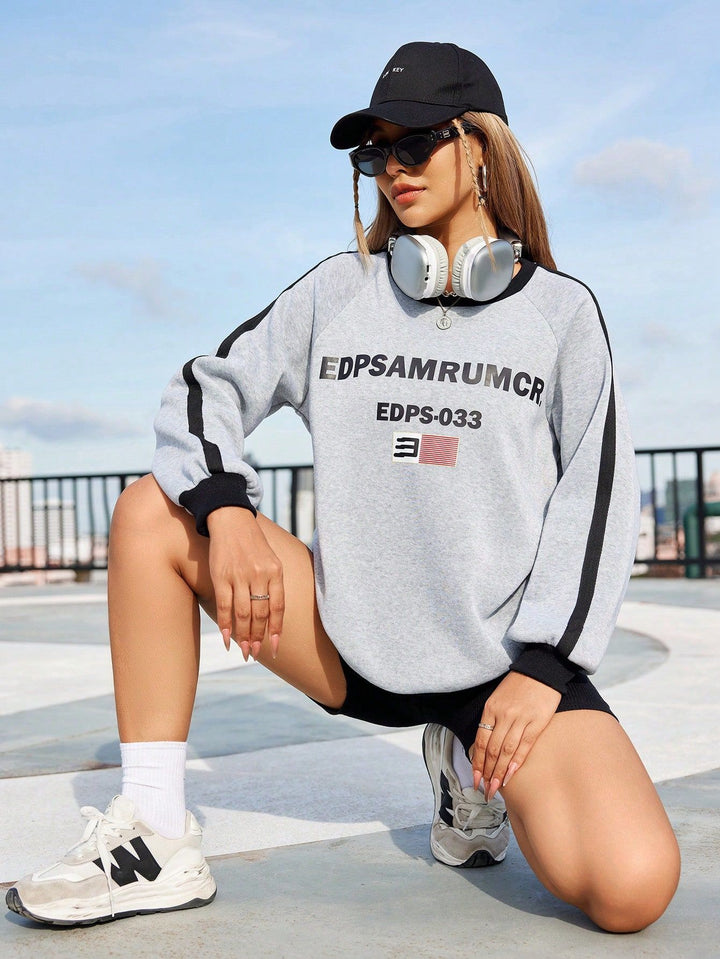 Sweat-shirt décontracté pour femmes avec impression graphique et manches contrastées Levoire