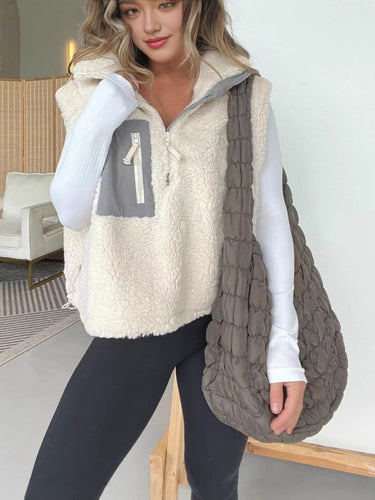 Gilet en polaire matelassé pour femmes avec fermeture éclair pratique et poches en fausse fourrure Levoire