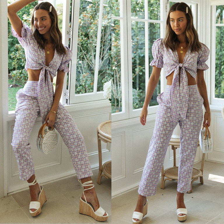 Ensemble femme en deux pièces avec un haut orné de nœuds et un pantalon à coupe large Levoire