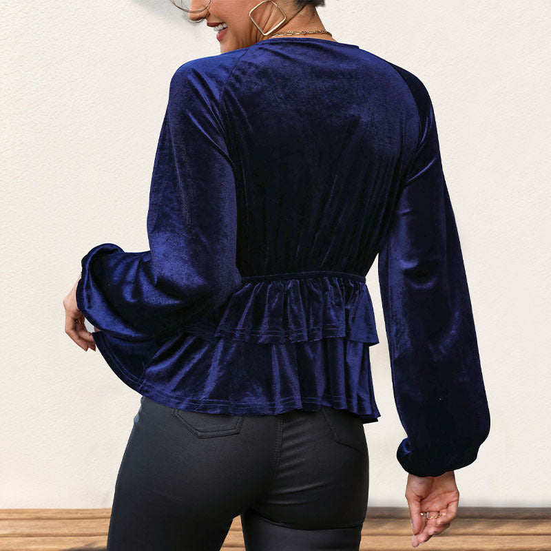 Top féminin avec un peplum volumineux et un décolleté en V profond Levoire