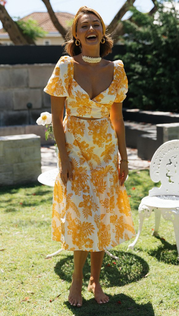 Robe midi femme avec décolleté en cascade et détails floraux Levoire