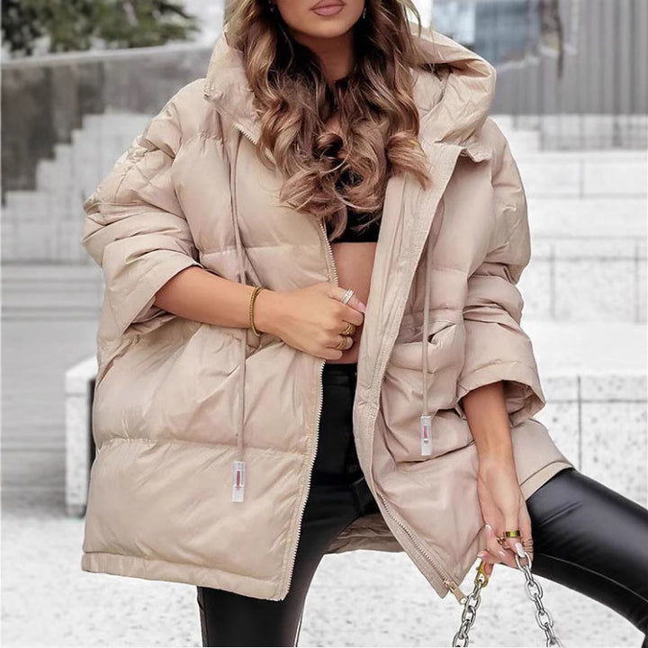 Veste de transition matelassée pour femmes avec capuche généreuse et détails modernes Levoire