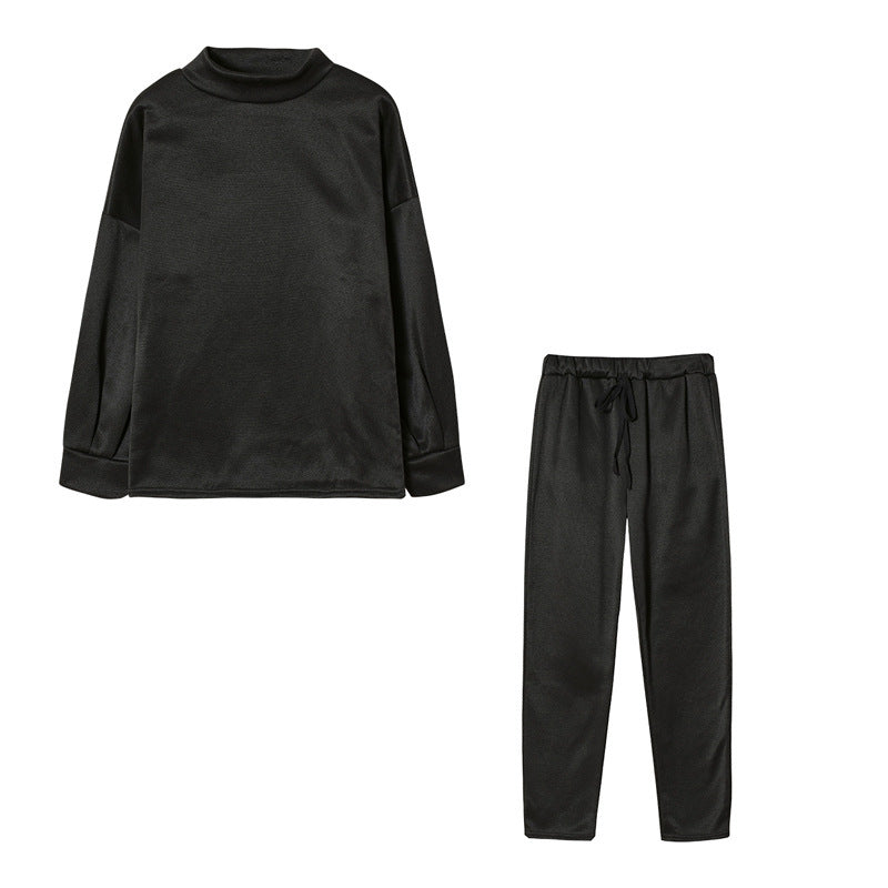 Ensemble de survêtement pour femmes avec une coupe moderne, un haut à col montant et un pantalon élastique Levoire