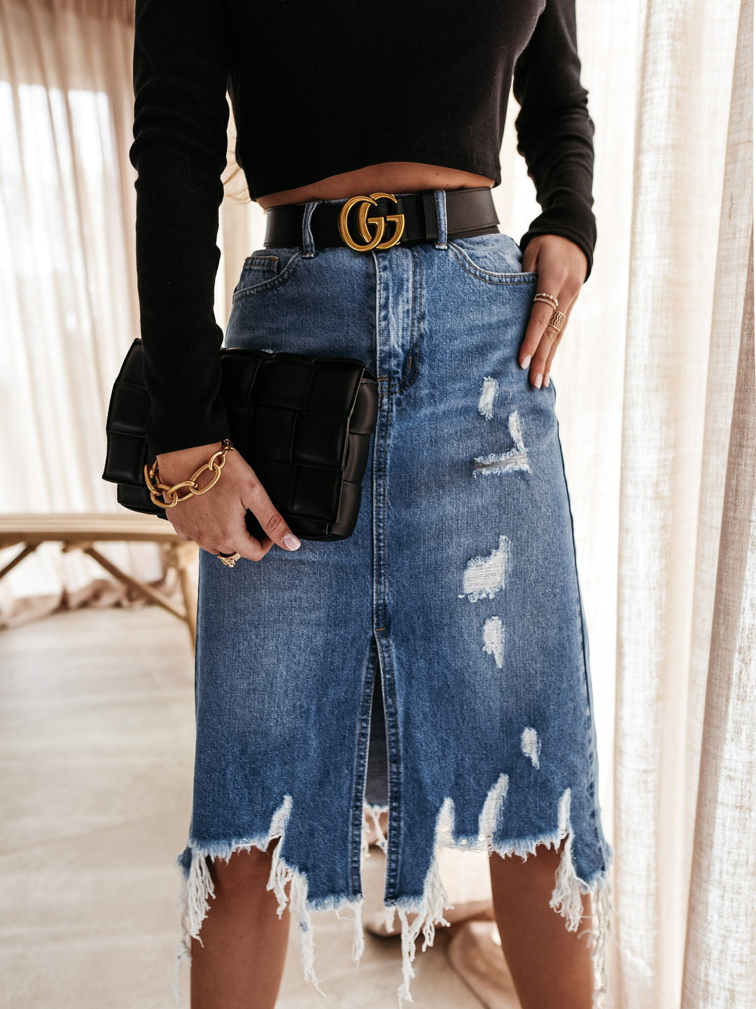 Jupe en denim décontractée pour femme avec ourlet asymétrique et détails déchirés Levoire