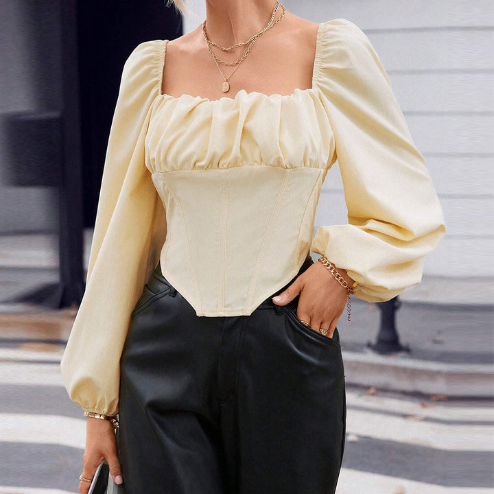 Blouse en dentelle pour femmes avec manches bouffantes et silhouette cintrée Levoire