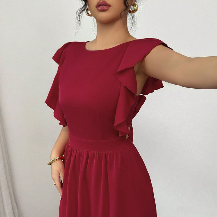 Robe maxi femme avec des détails de volants volumineux et une découpe sophistiquée dans le dos Levoire