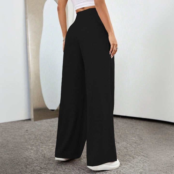 Pantalons palazzo taille haute généreux pour femmes avec élégants plis et bouton visible Levoire