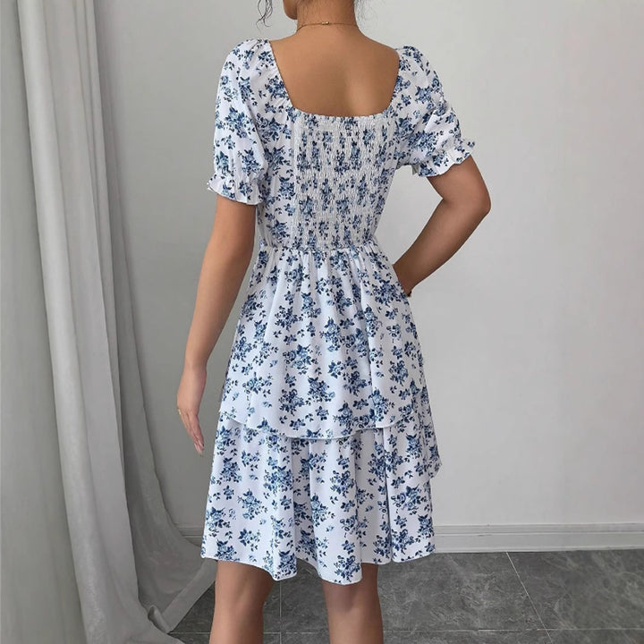 Robe mini imprimée de fleurs pour femmes avec des manches bouffantes volumineuses et un ourlet swing