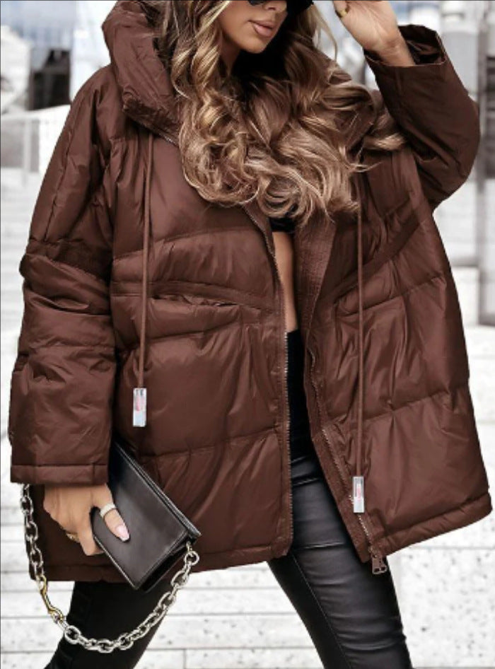 Veste de transition matelassée pour femmes avec capuche généreuse et détails modernes Levoire