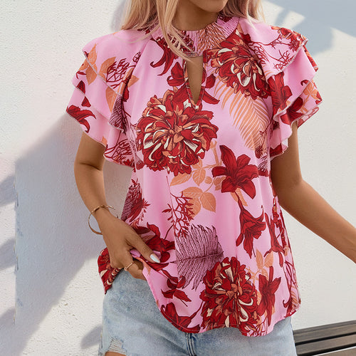 Top féminin avec des détails de volants ludiques et un motif floral Levoire