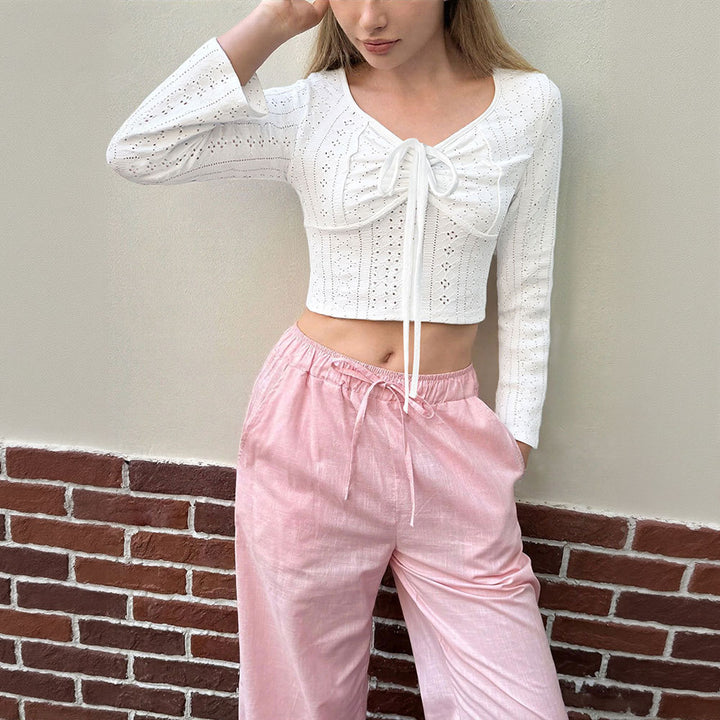Chemise pour femme à manches longues raccourcies avec un élégant lacet et un délicat broderie en œillets Levoire