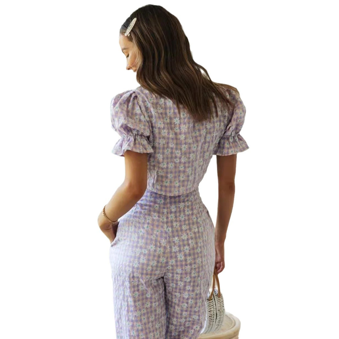 Ensemble femme en deux pièces avec un haut orné de nœuds et un pantalon à coupe large Levoire
