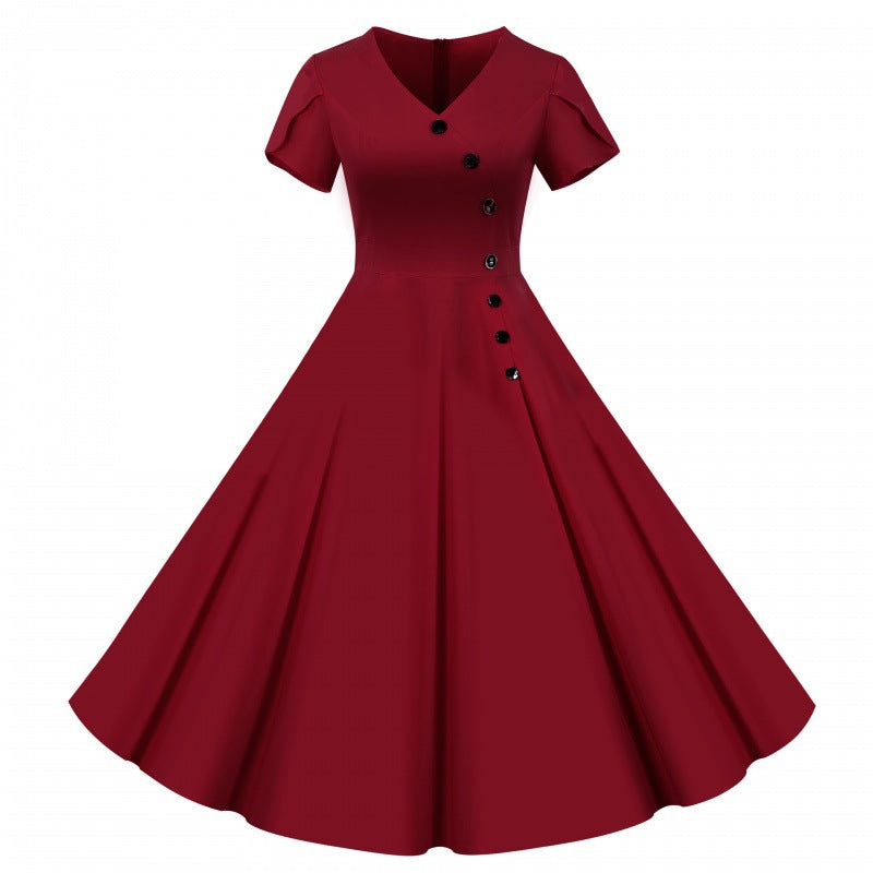 Robe swing femme avec un col en V à boutons et une jupe évasée.
