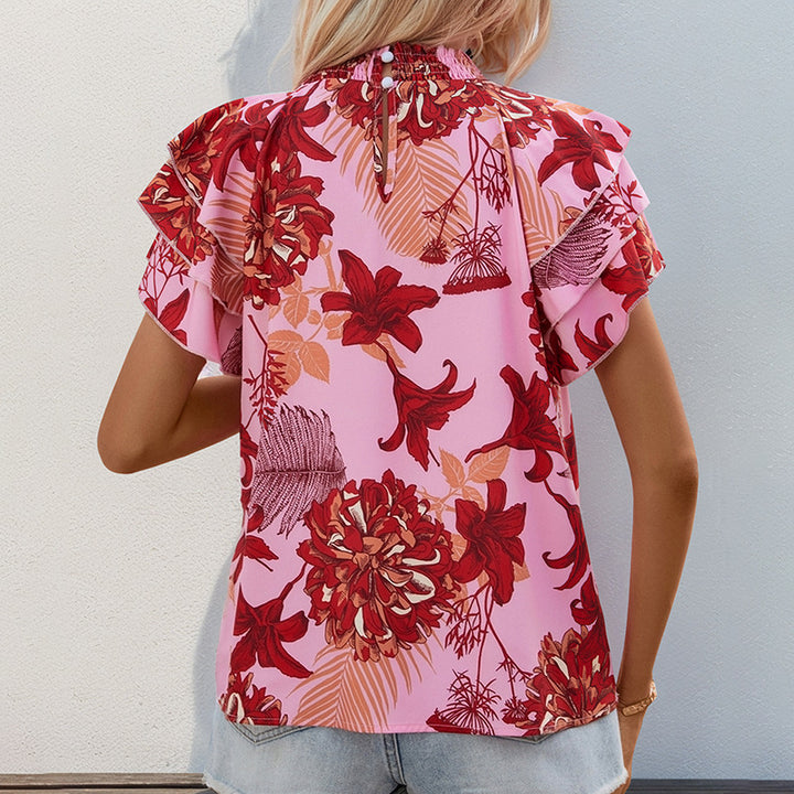 Top féminin avec des détails de volants ludiques et un motif floral Levoire