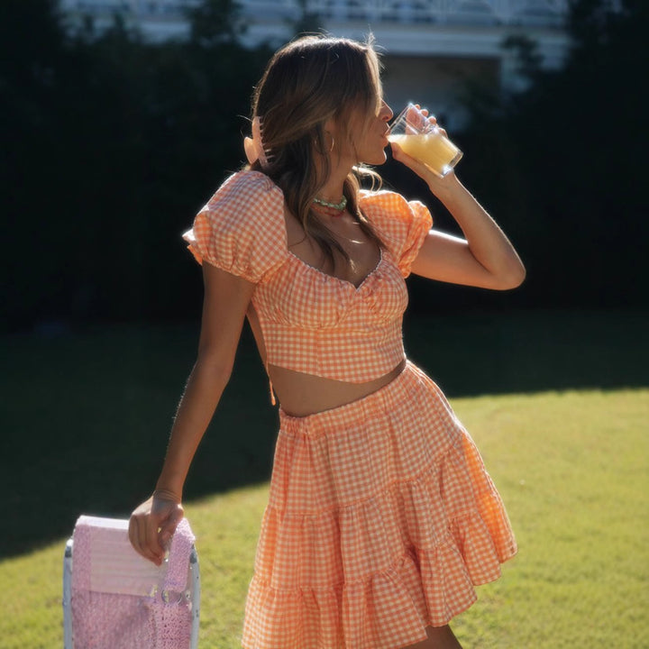 Ensemble femme en deux pièces composé d'un crop top et d'une jupe à carreaux Levoire