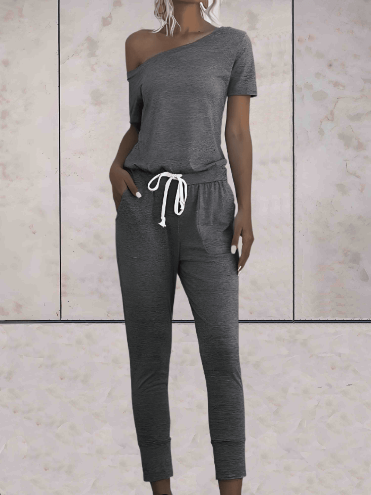 Levoire | Combinaison Confortable À Une Épaule Avec Des Manches Dénudées Et Un Bouton Réglable Aux Hanches Gris