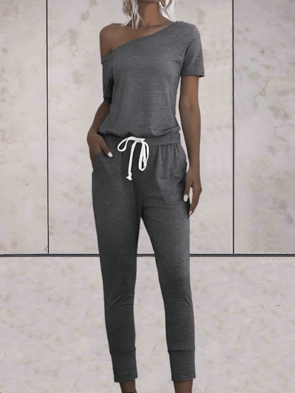 Levoire | Combinaison Confortable À Une Épaule Avec Des Manches Dénudées Et Un Bouton Réglable Aux Hanches Gris