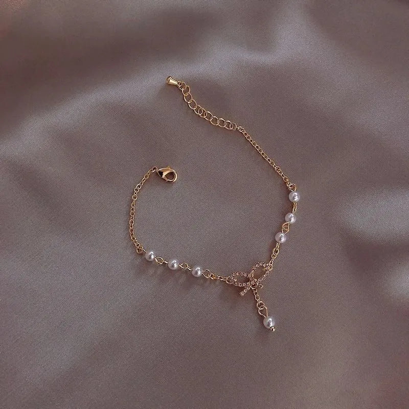 Levoire | Bracelet Élégant En Perles Avec Nœud En Cristal