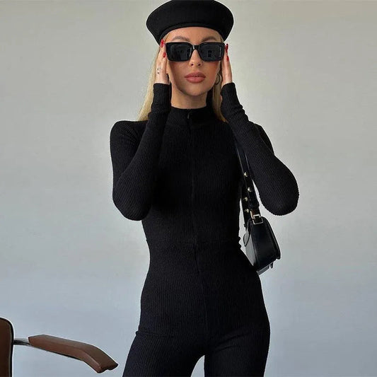 Levoire | La combinaison longue à manches longues stretch a une fermeture éclair sur la poitrine