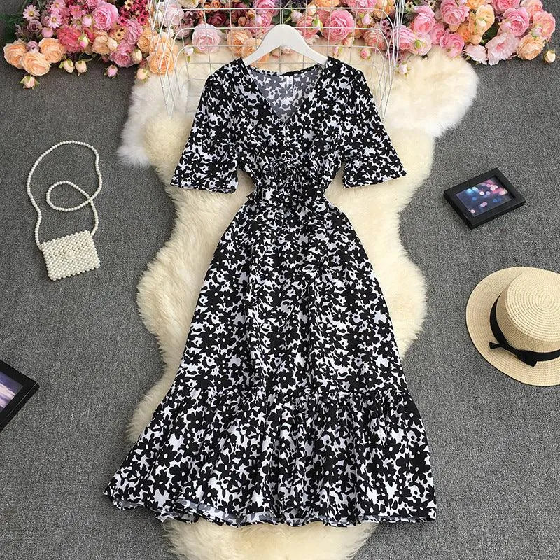 Levoire | Robe à fleurs à encolure en V avec manches bouffantes Blocs blancs avec du noir Une taille