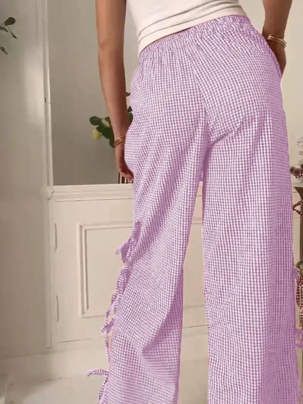 Levoire | Mode dames pantalons carotte avec motif à carreaux et bretelles