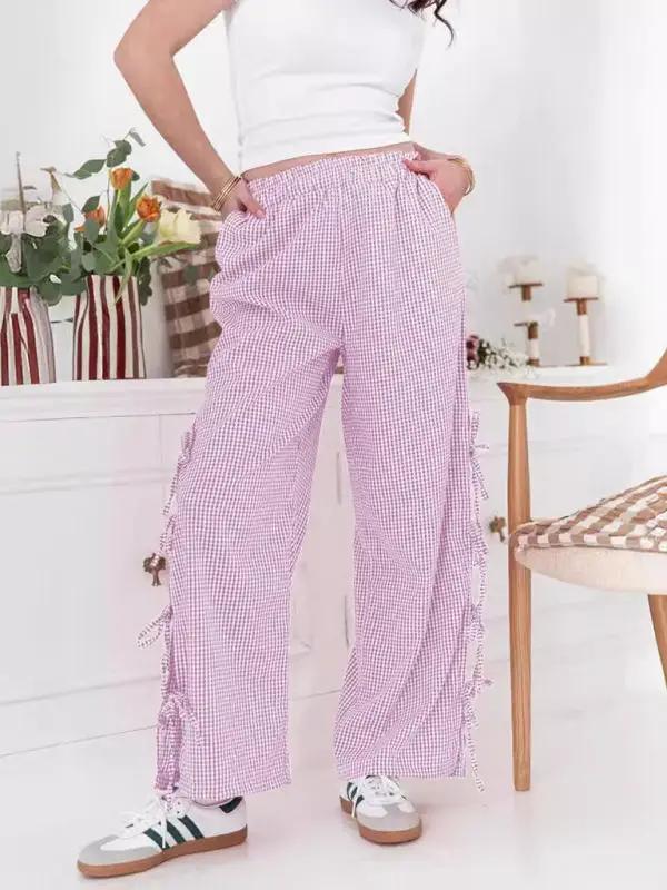 Levoire | Mode dames pantalons carotte avec motif à carreaux et bretelles